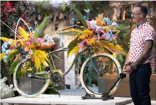 colorful floral arrangement on vintage bicycle