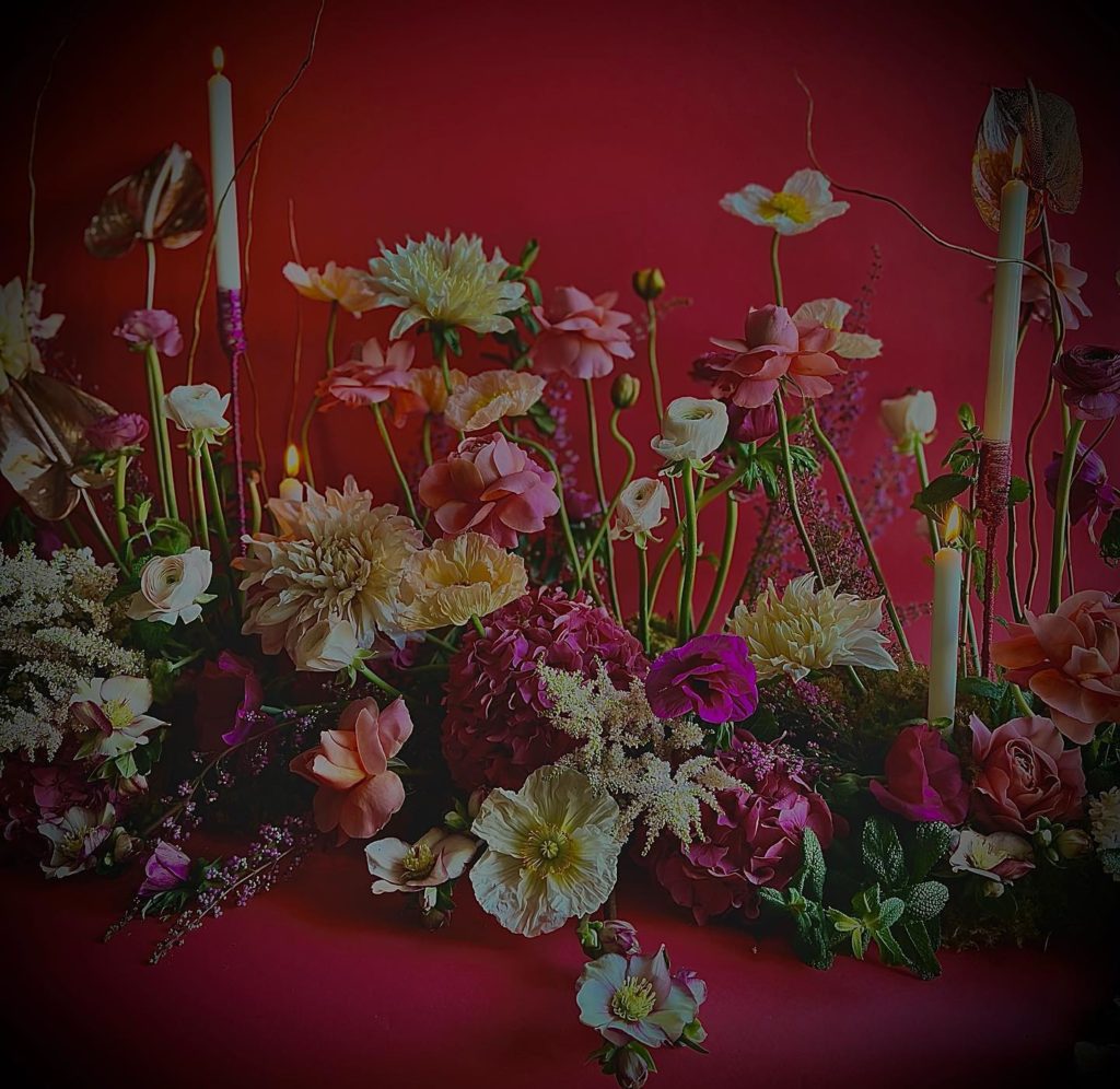 colorful floral arrangement with candles